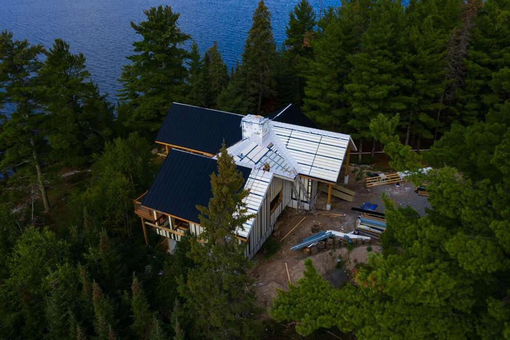 Top down view of panels being installed on roof. © robert lowdon