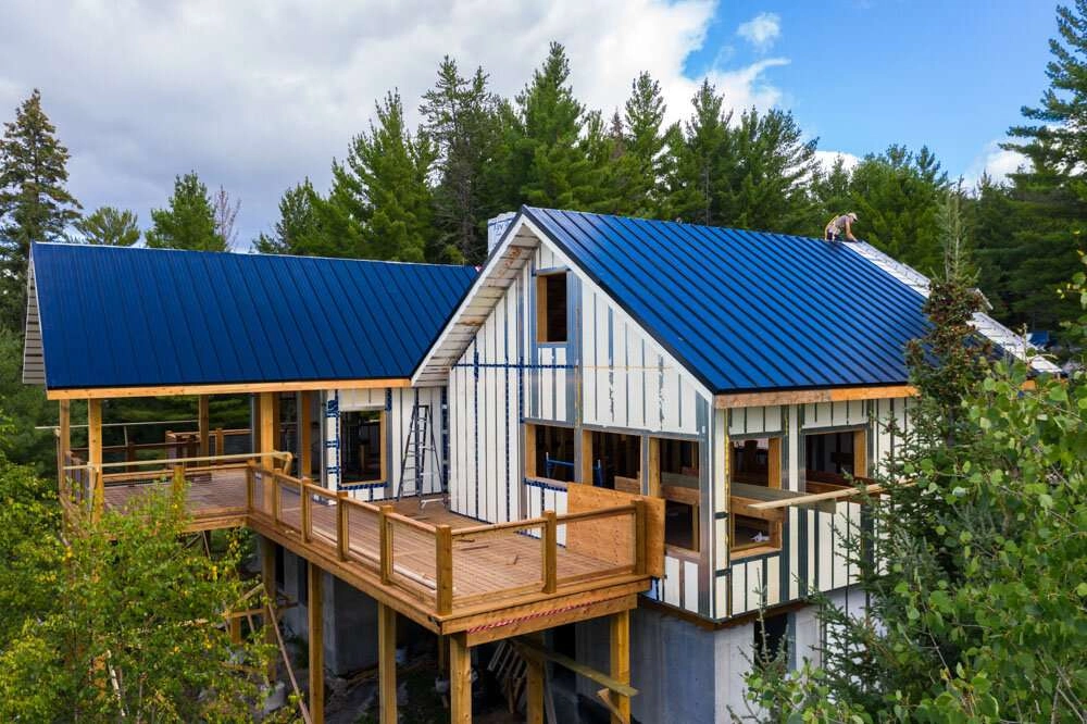 Installing roofing over panels © robert lowdon