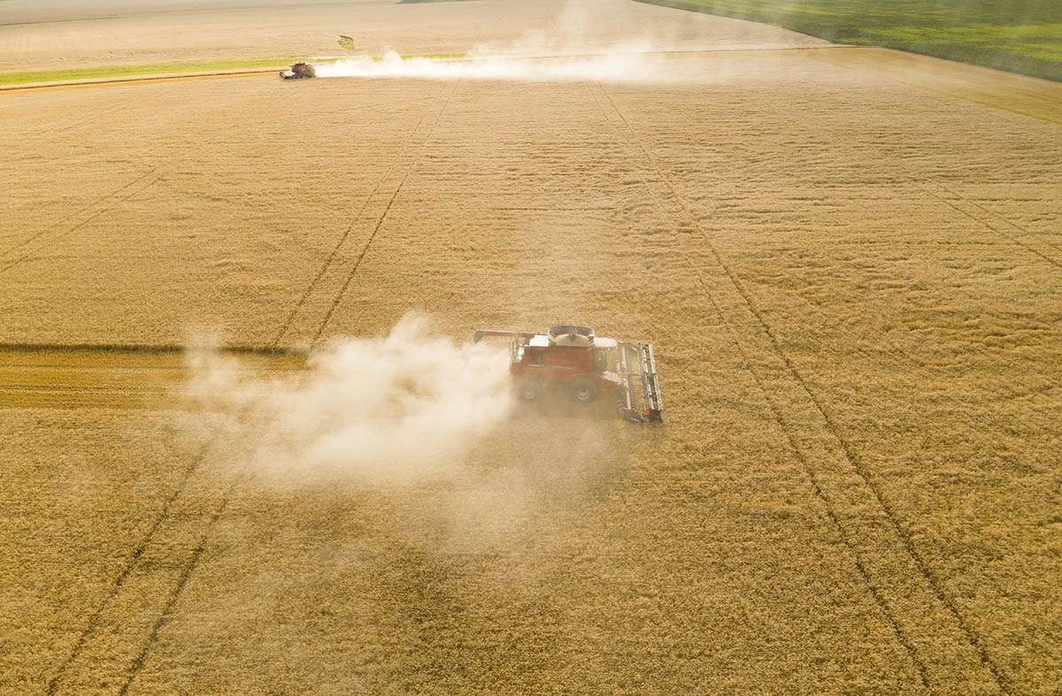 Agricultural drone photography of combine at harvest