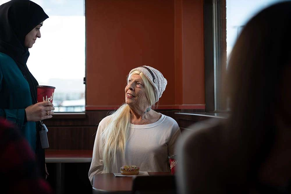 A counselor for yssn brings a coffee. © robert lowdon