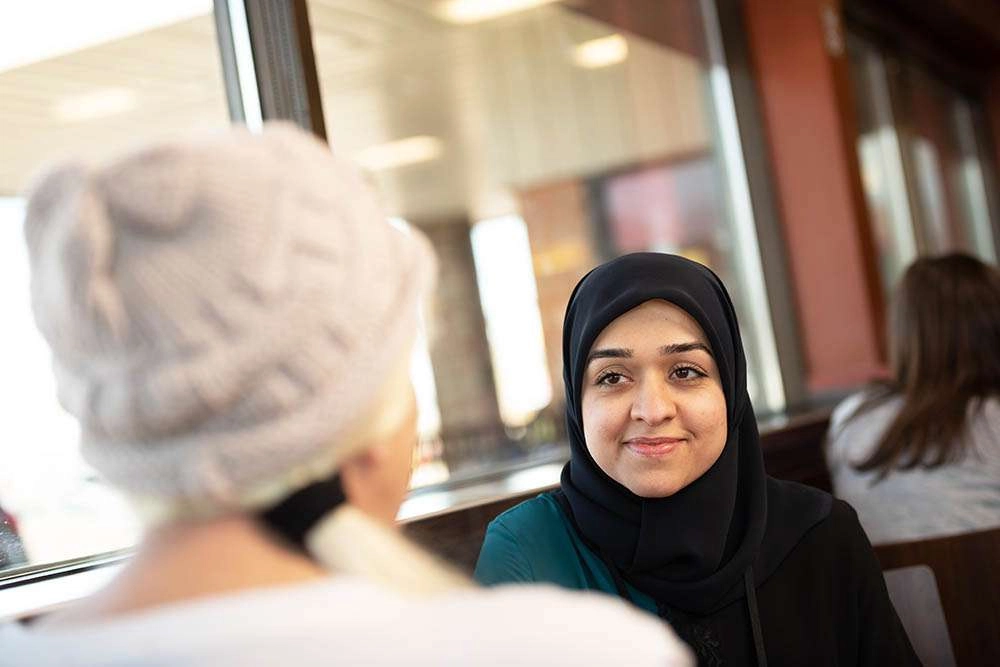 A conversation over coffee. © robert lowdon