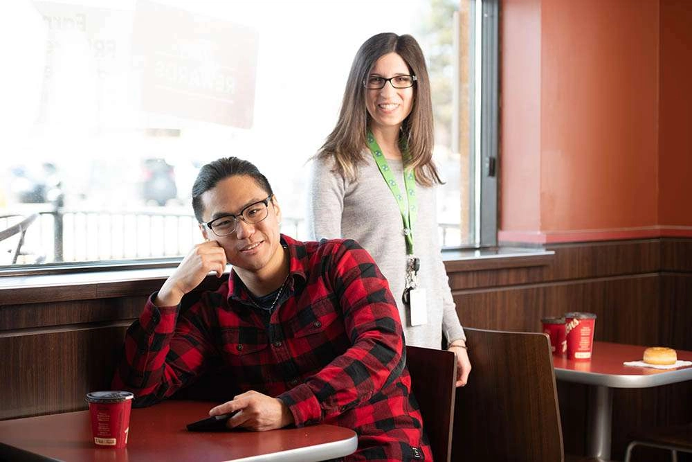 Two staff members at a table © robert lowdon