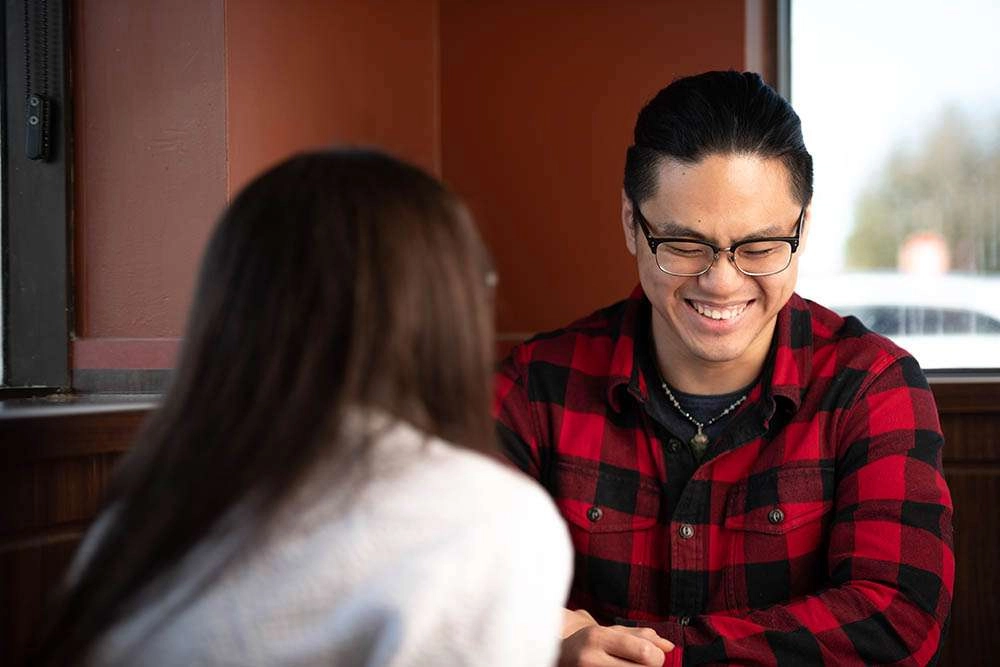 A client and counselor share a laugh © robert lowdon