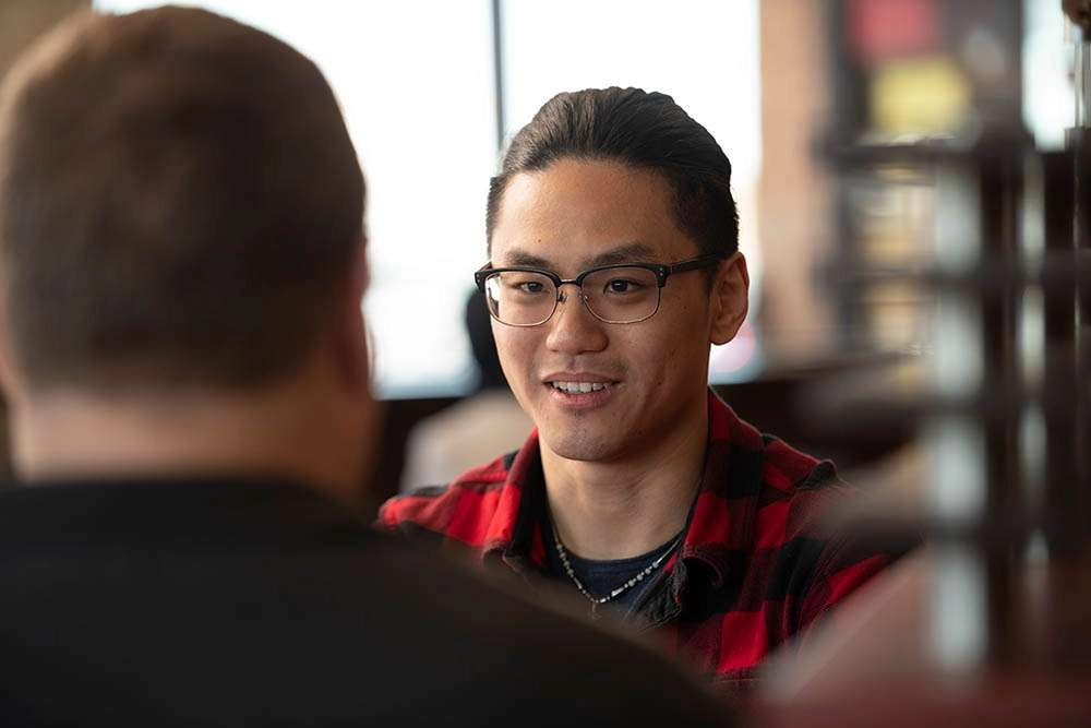 Close up of a conversation. © robert lowdon