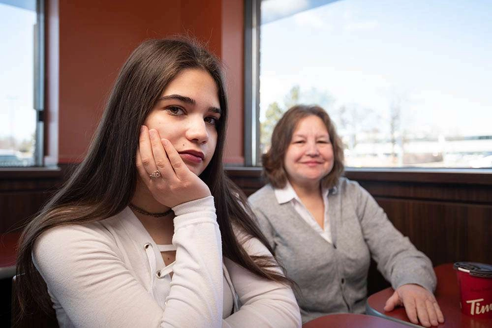 A young client of yssn with her mother. © robert lowdon