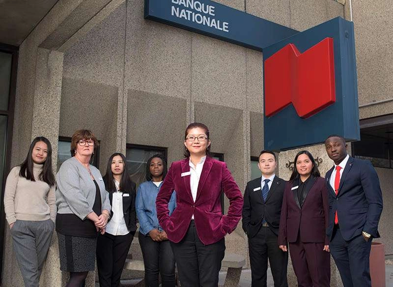 Group of financial company employees outside