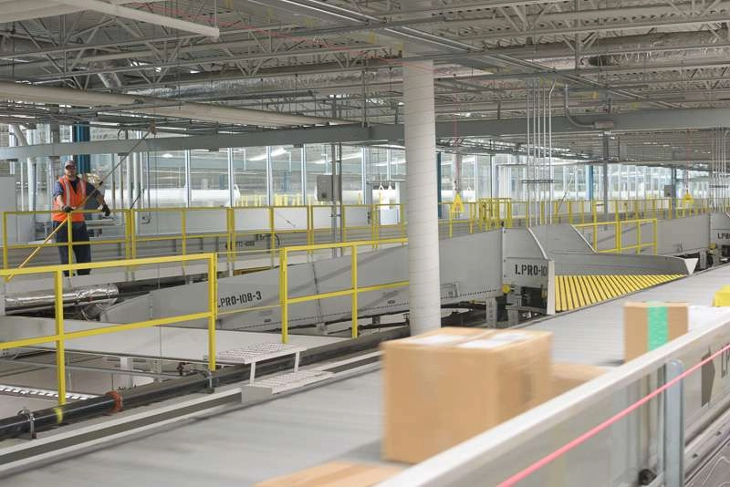 Worker inspects production lines at plant