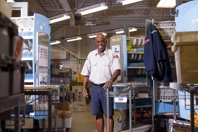 Mail carrier at sort table