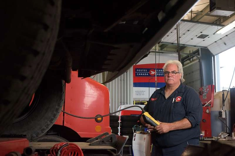 Mechanic hoist truck on lift
