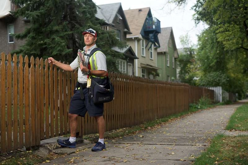 A mail carrier enters the yard of a residential neighborhood. In this image there is one light to the left of the subject. I wanted to add some contrast to an other wise cloudy day.