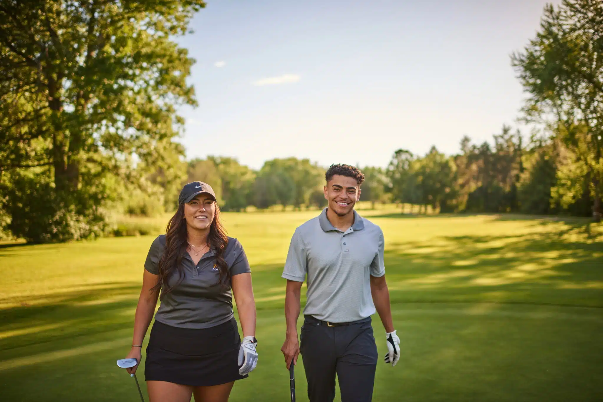 Rebranding image of golfers walking on golf course