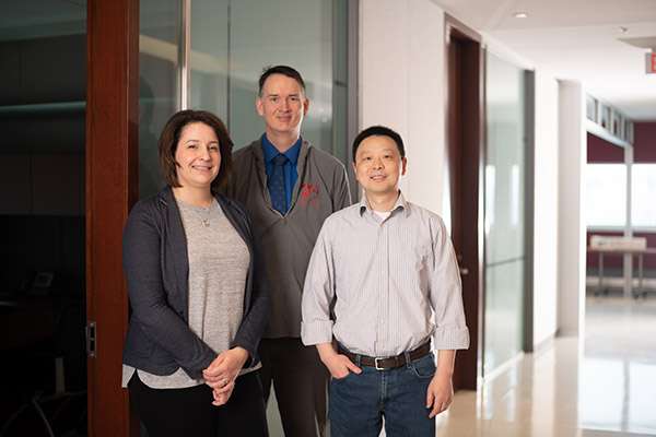 Photographing A Large Medical Research Facility - Dsc 7574Copy Three team members in a hallway