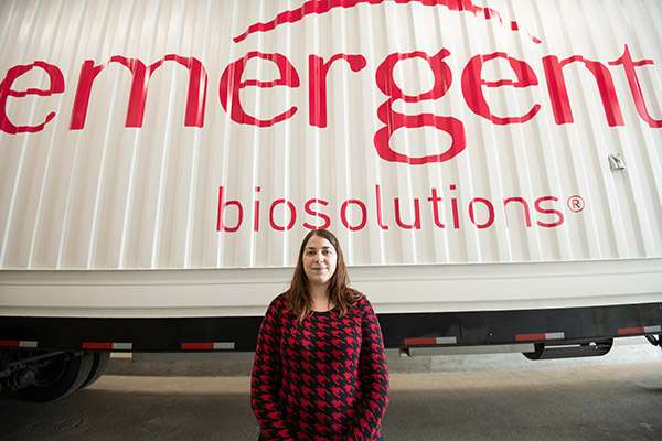 Photographing A Large Medical Research Facility - Dsc 8330Copy A wide angle shot of an employee with the company logo in the background.