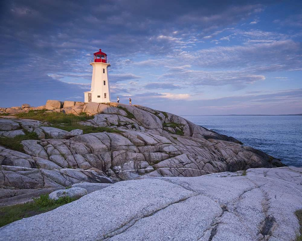 People outside the lighthouse at peggy’s cove. © robert lowdon
