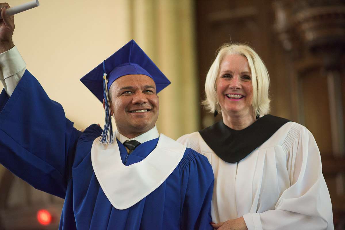 Editorial Photography For Cdi College - Editorial Photgrapher Robert Lowdon Cdi 12 In this action shot, a new graduate raises their diploma, victoriously, with an instructor at their side.