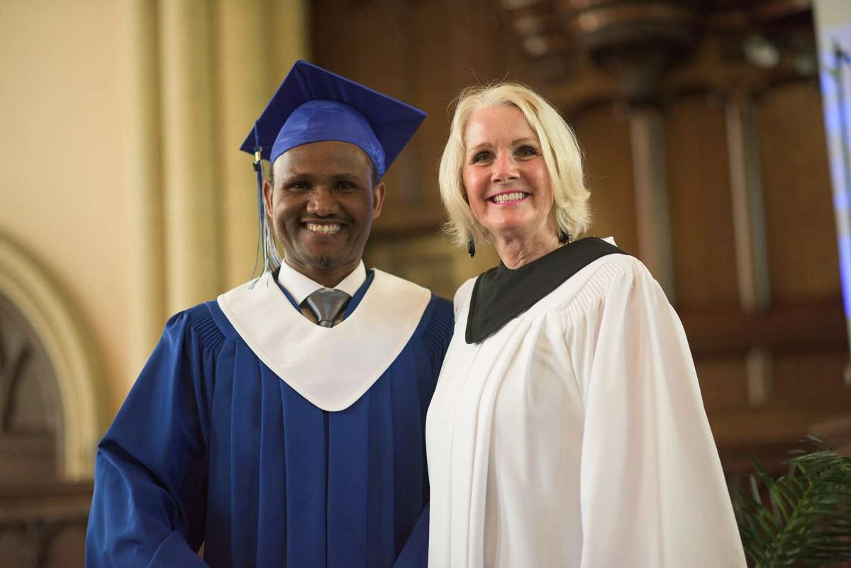 Editorial Photography For Cdi College - Editorial Photgrapher Robert Lowdon Cdi 13 In this medium close-up, a student and instructor pose, smiling for the camera.