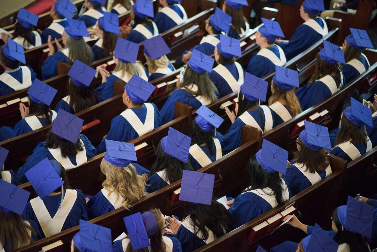 Editorial Photography For Cdi College - Editorial Photgrapher Robert Lowdon Cdi 7 This overhead shot captures rows of seated graduands in blue caps and gowns. The downward angle emphasizes the number of students in the room and offers a visually interesting perspective.
