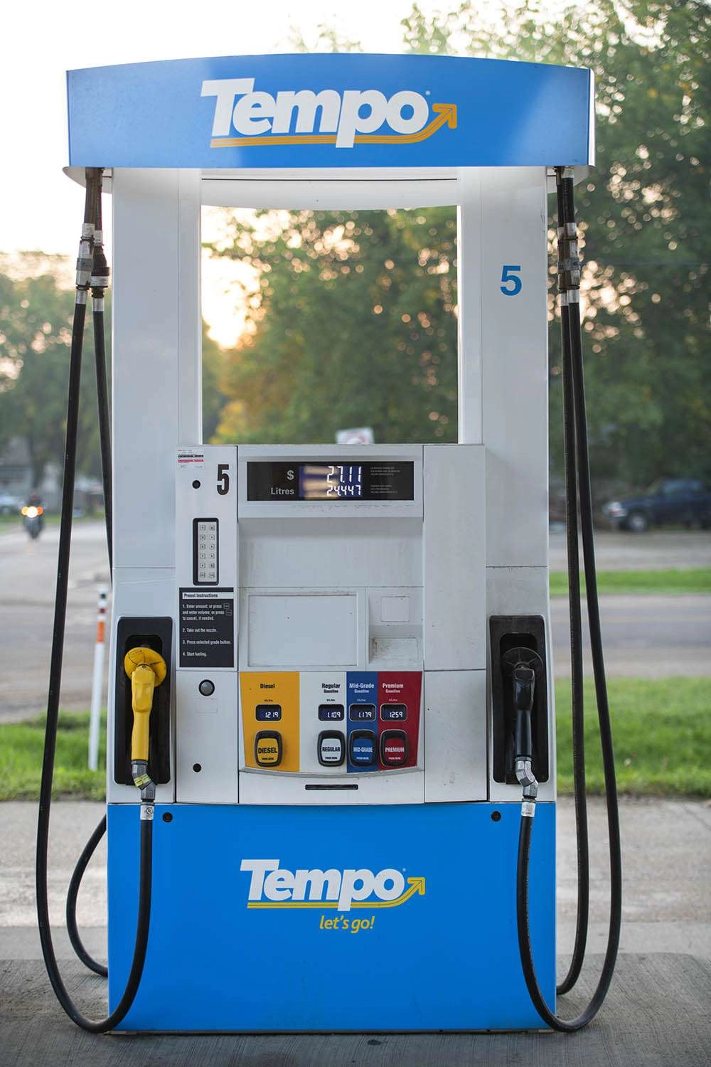 Tempo Gas Station Photography : On Brand - Gas Station Photography 010 Sun rising behind the gas pump, with a motorcycle in the background, priceless. © robert lowdon