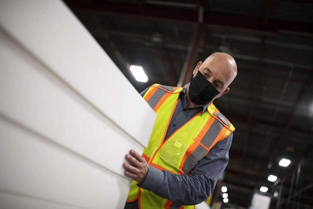 supervisor inspects finished product