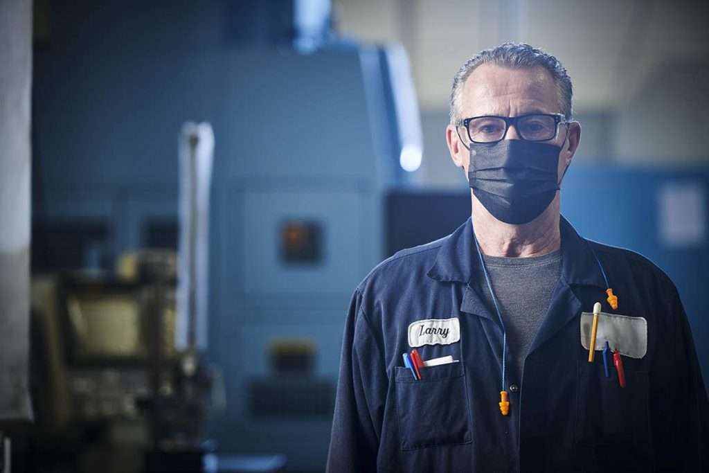 industrial machine with factory worker