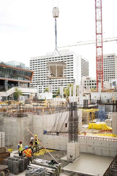 Crane lifts cement in site