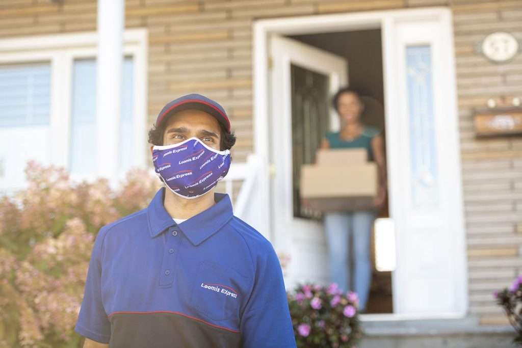 courier delivers package at home