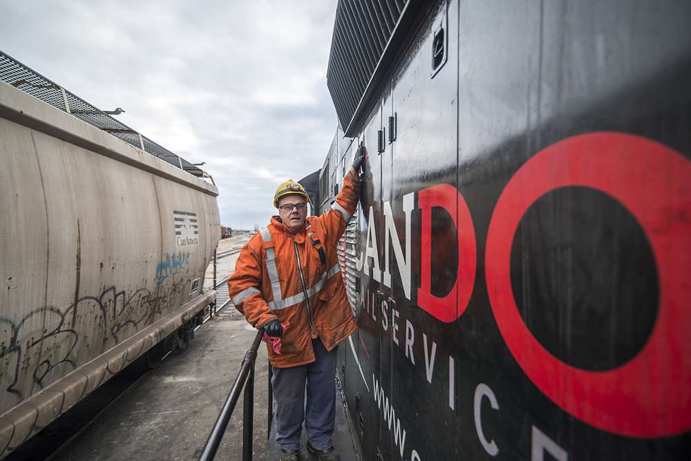 mechanic works on locomotive