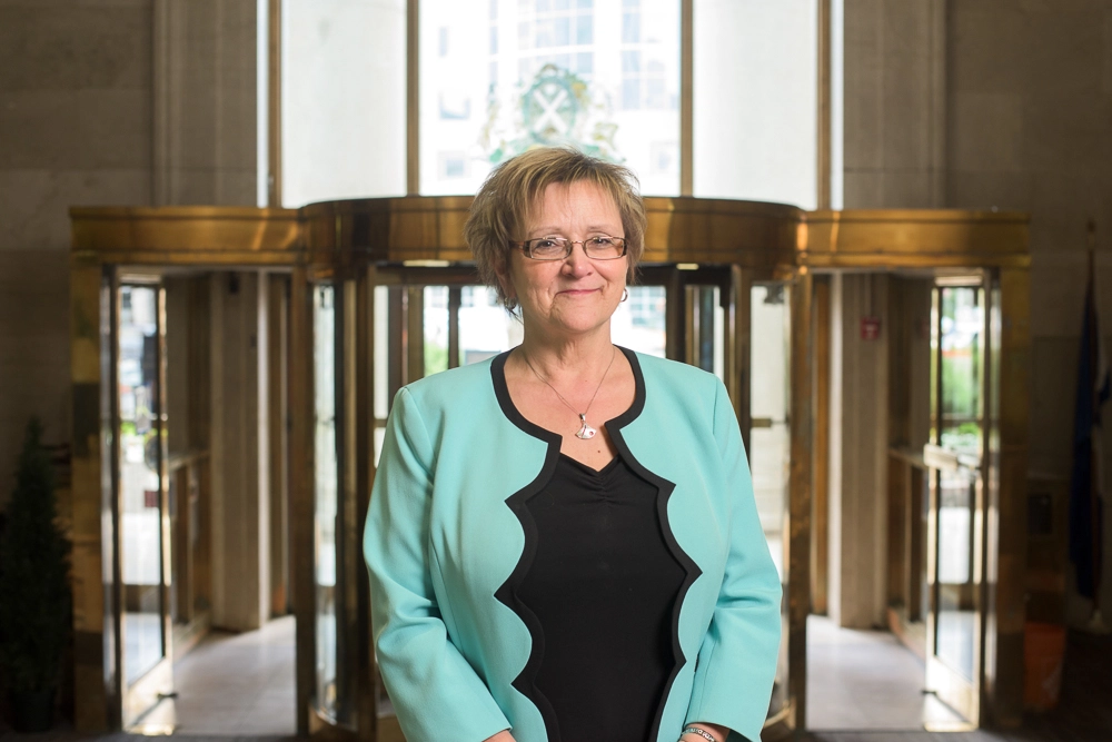 Photograph of bank executive in back lobby