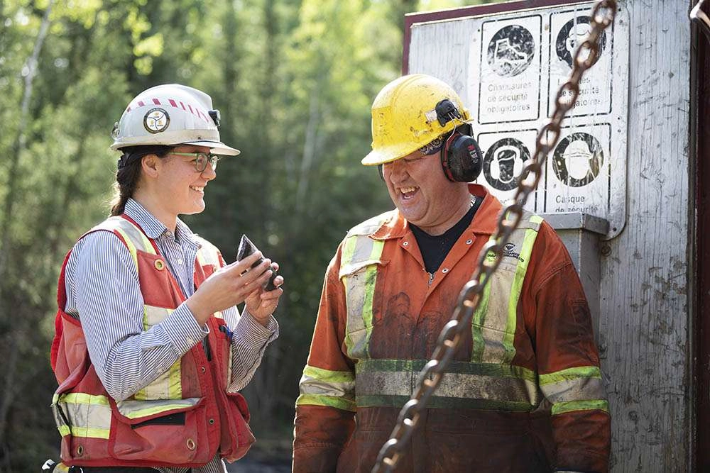 geologist and driller with core sample