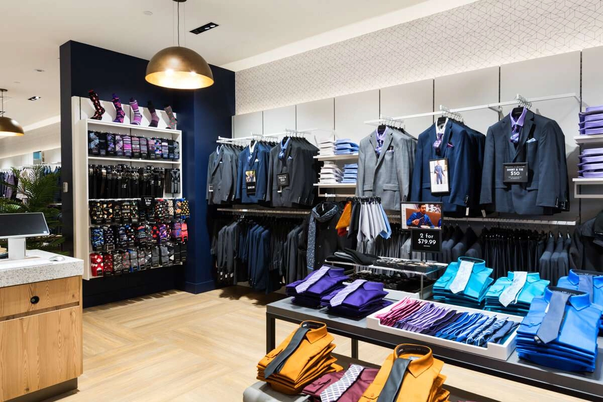 Shirts in the foreground with sock display in corner.