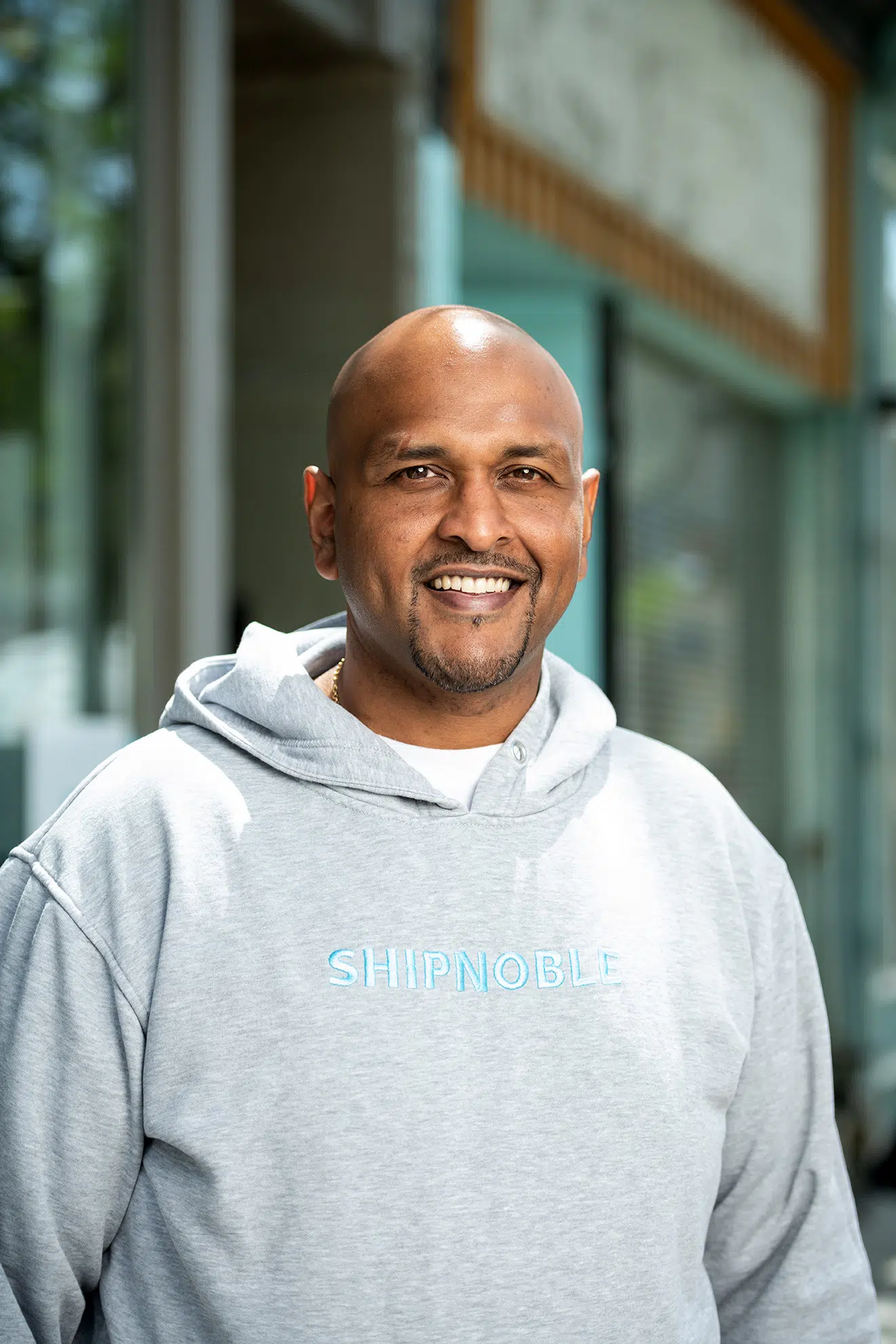 A business headshot with a natural background