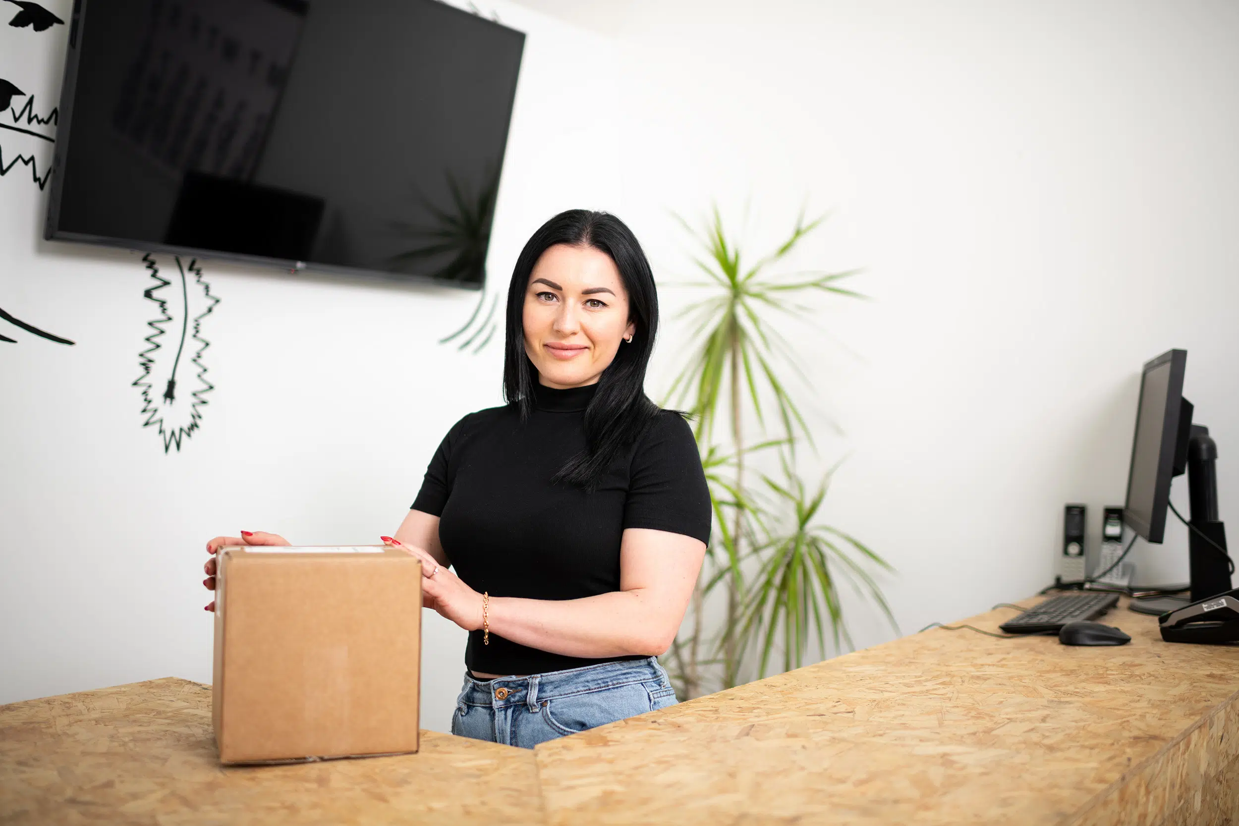 Image of employee handling package