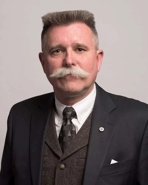 Corporate headshot of an executive