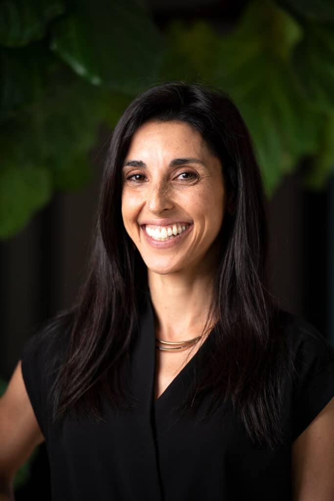 Headshot with plant in background